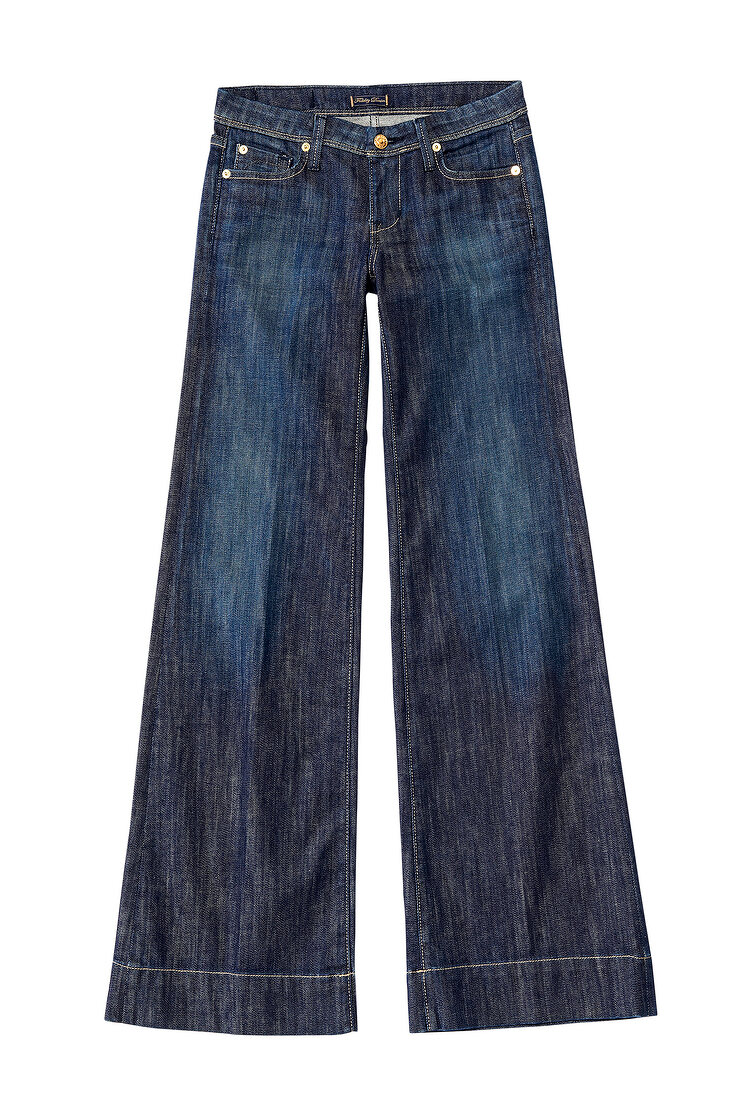 Dark blue bell bottom jeans with rhinestones on pocket against white background