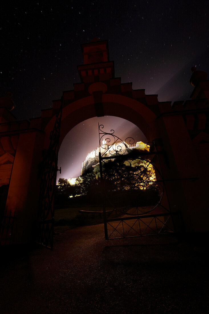 View of castle gate at night in Styria, Austria
