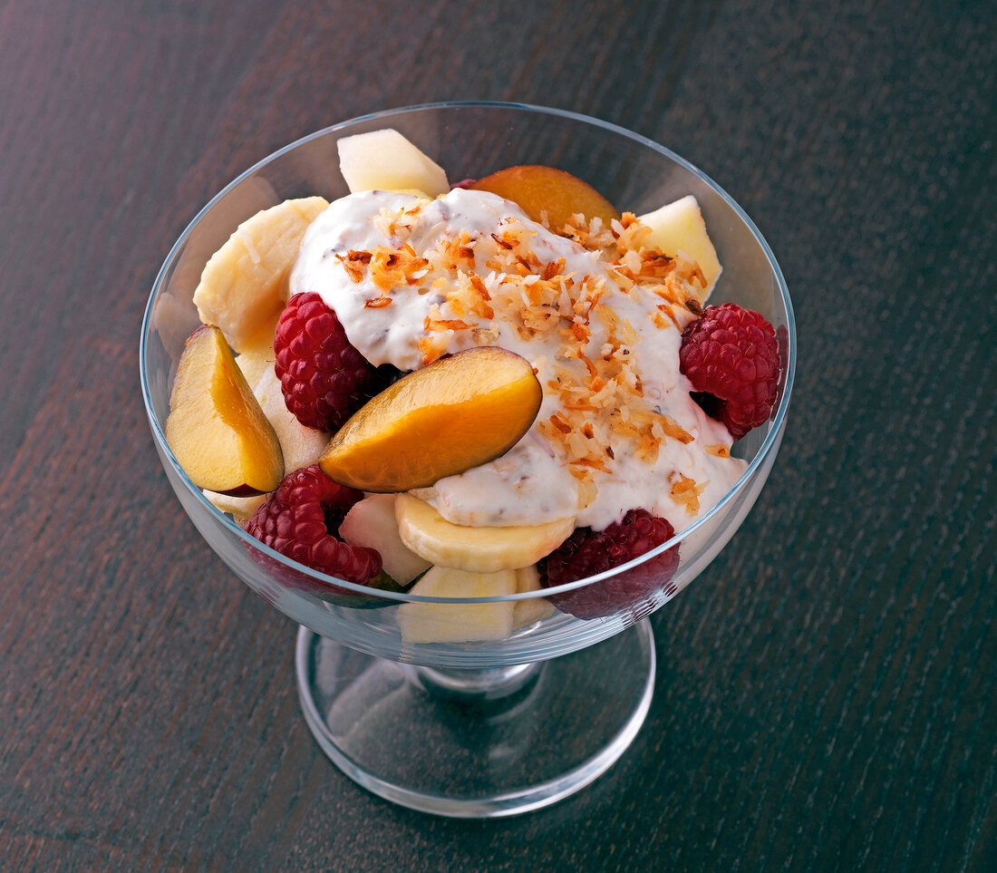 Fruit with coconut sauce in glass