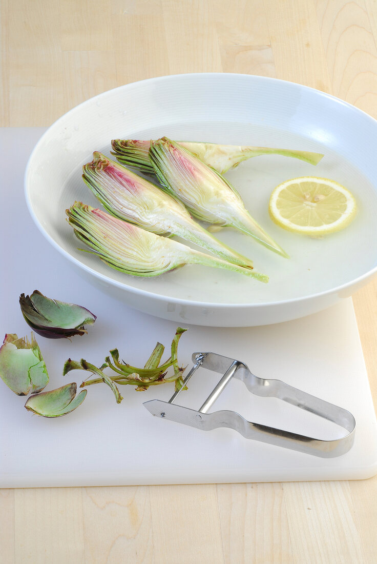 Sliced artichoke for preparation of artichoke salad with port wine mayonnaise, step 1