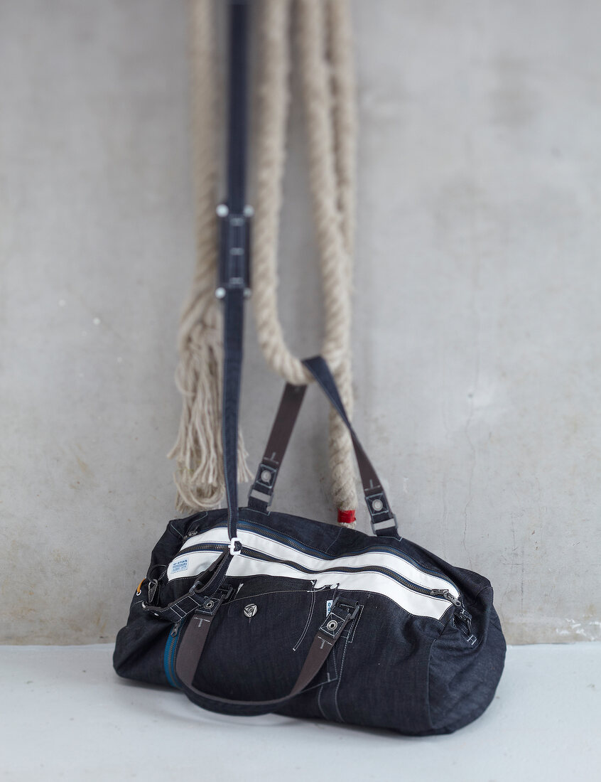 Close-up of denim bag with rope