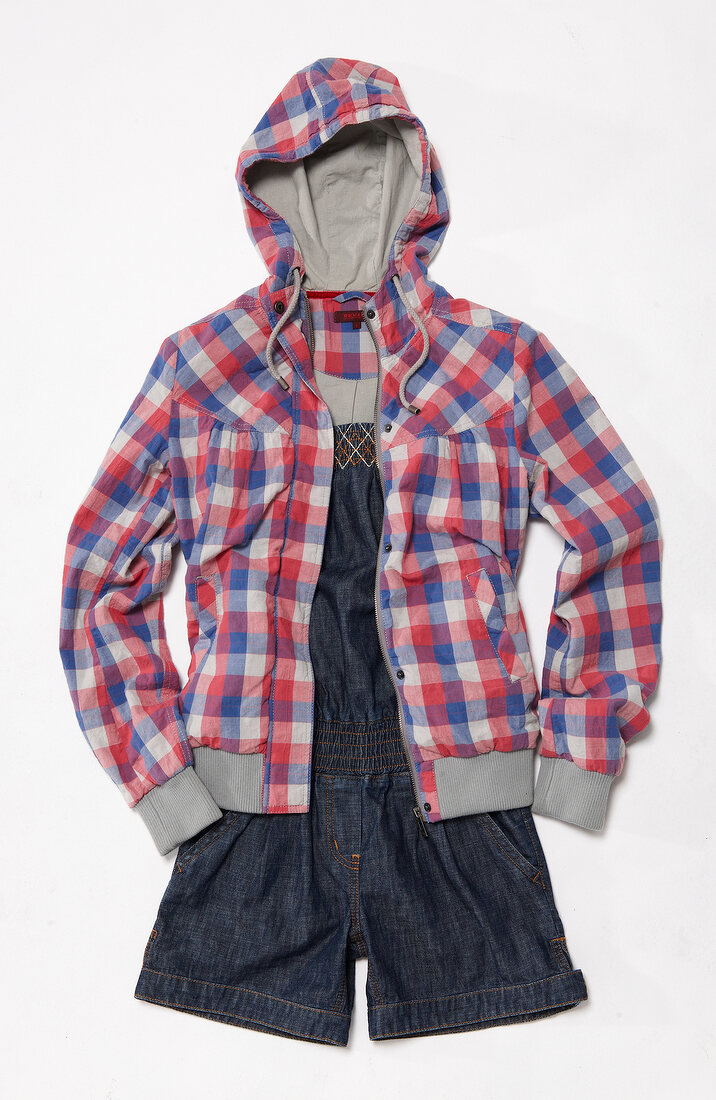 Denim jumpsuit, jacket with checks pattern and gray cuffs on white background