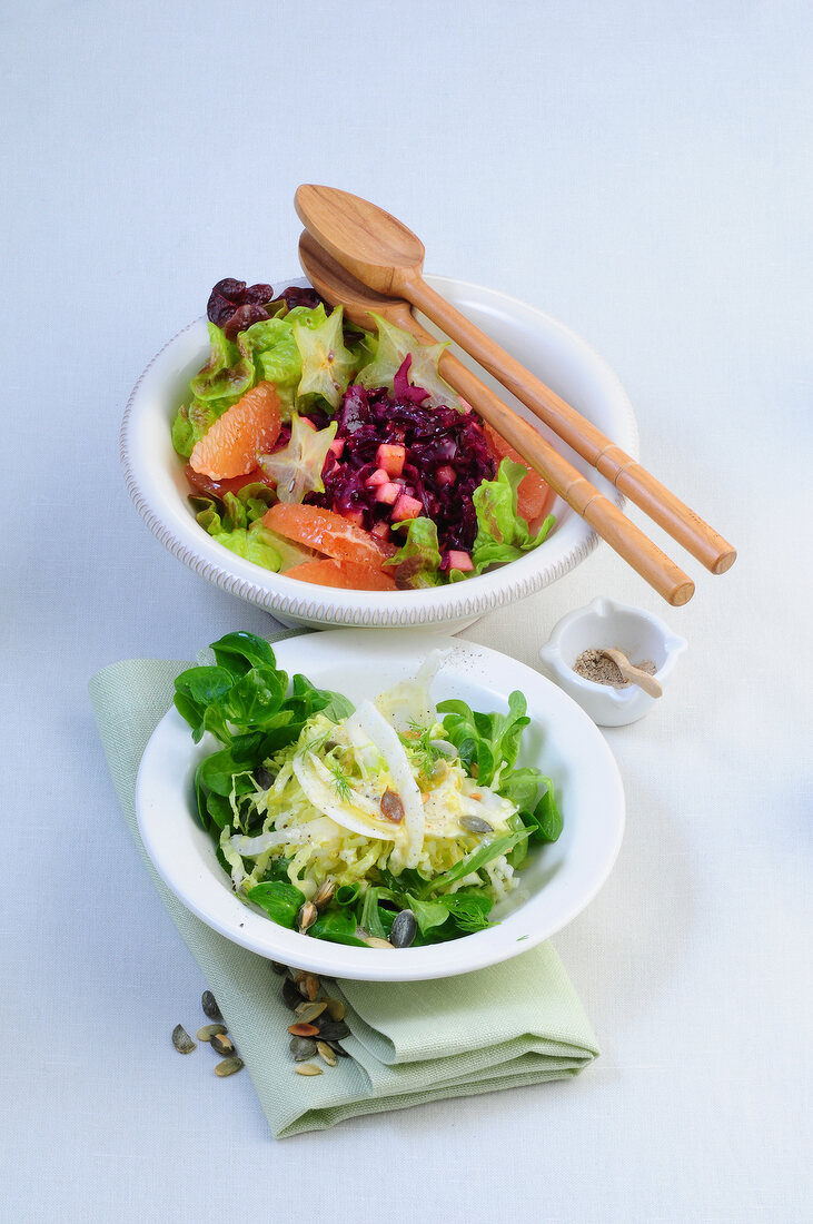 Red cabbage and apple salad with fennel and cabbage salad in bowls