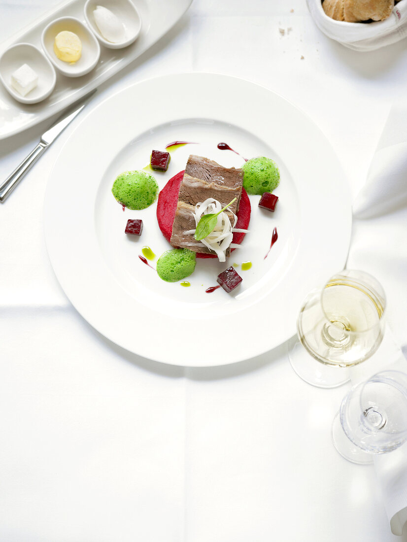 Boiled beef with smoked beetroot and mashed potatoes on plate