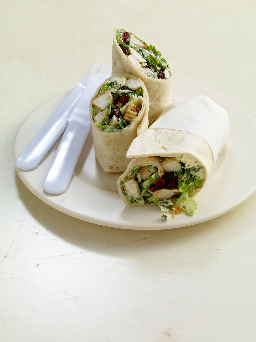 Close-up of wraps with chicken and roquefort on plate