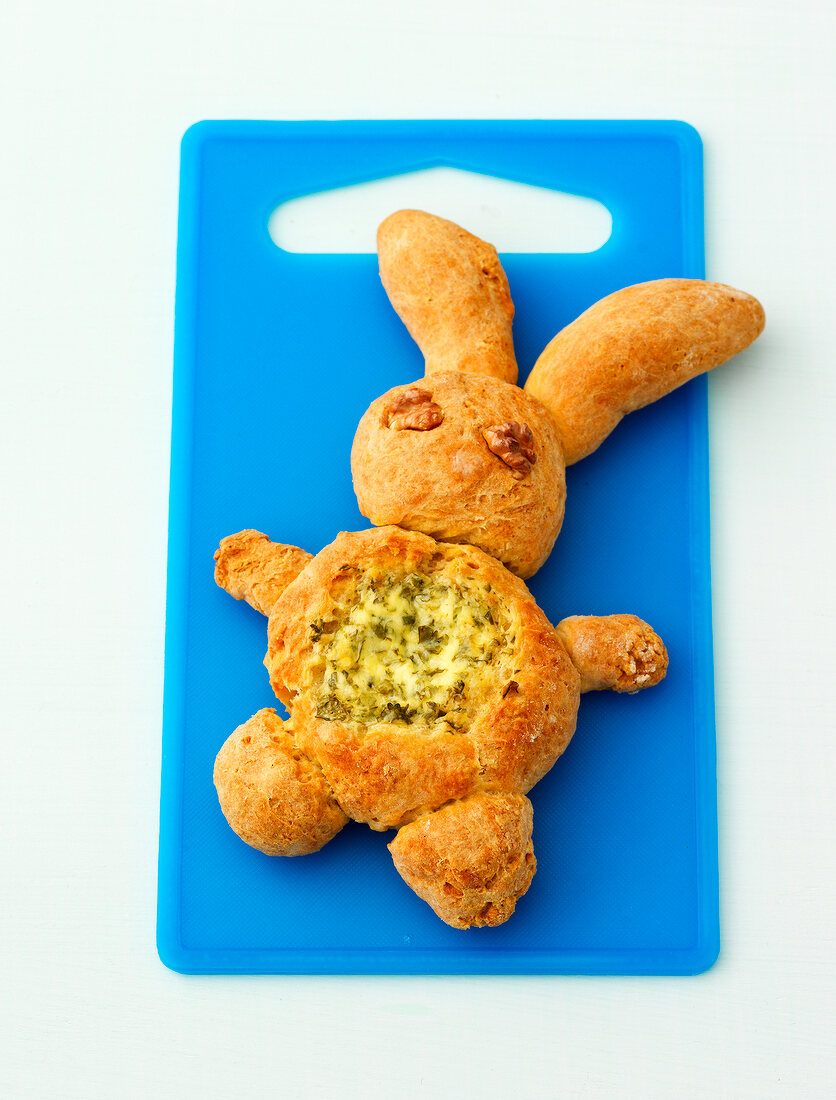 Quarkteig bunny filled with herbs on cutting board