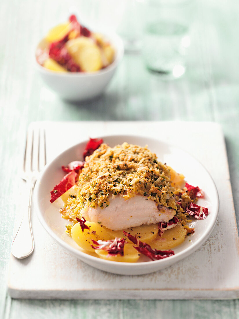 Cod fillet with herb crust in bowl