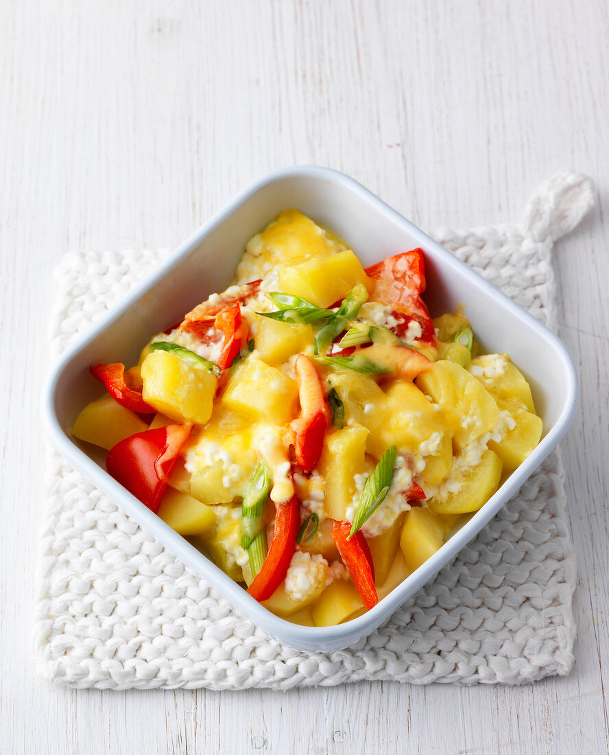 Boiled potatoes and red peppers in bowl