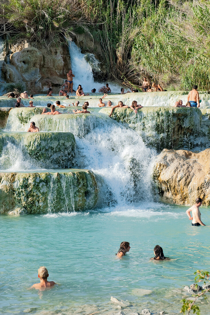 People bathing in the thermal springs of Saturnia in Tuscany, Italy