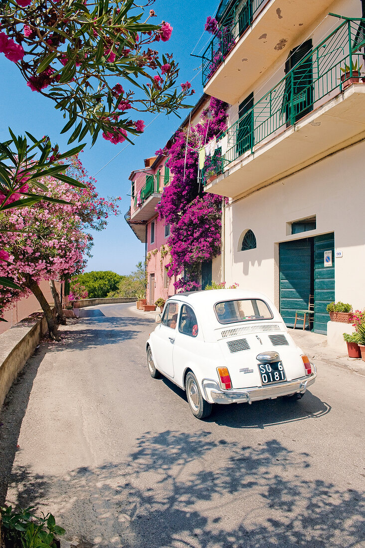 View of car driving through narrow streets in Capoliveri, Elba, Italy
