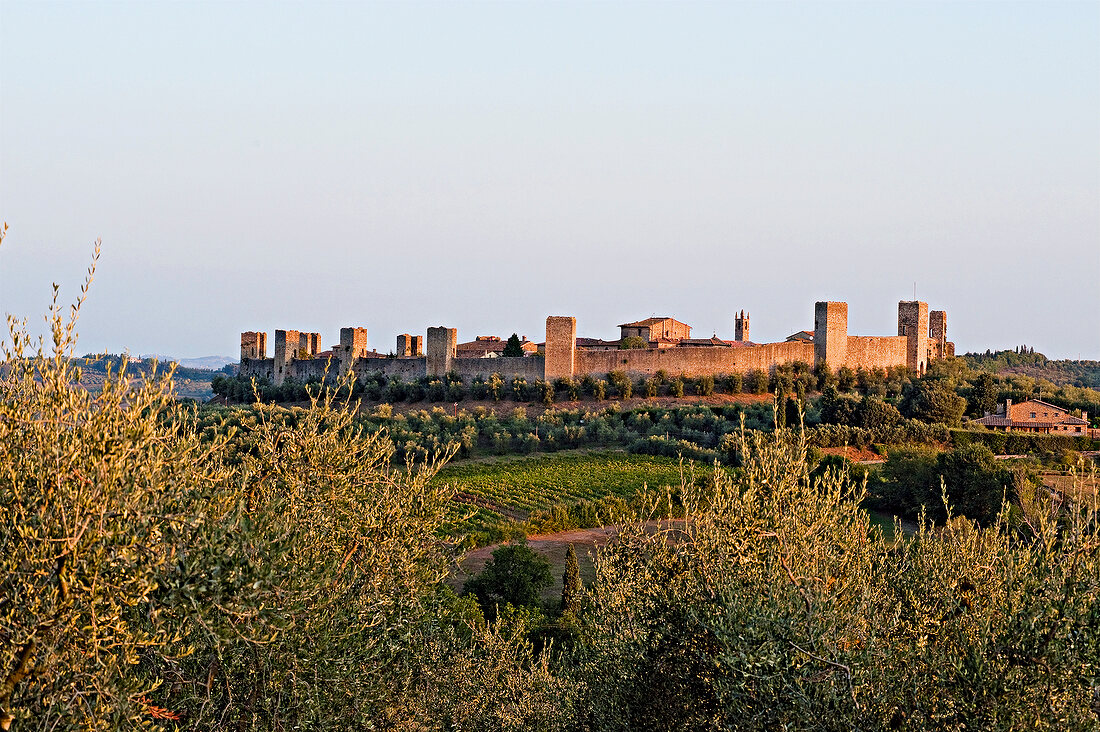 View of fortress of Monteriggioni at dusk, Siena, Italy