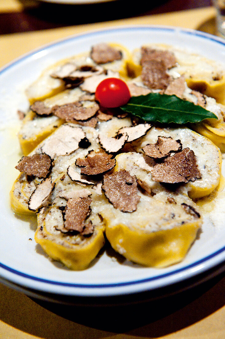 Close-up of pasta dish with fresh truffles on plate