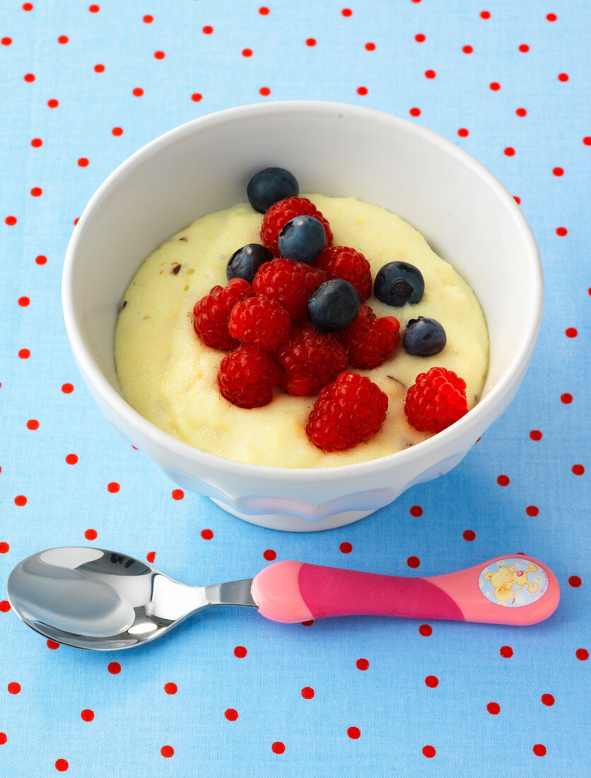 Semolina pudding with berries in bowl