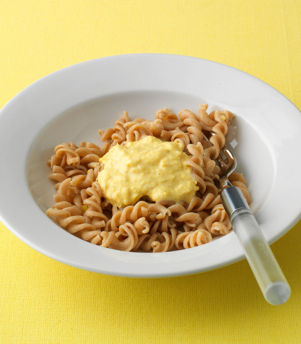 Whole wheat pasta with yellow noodle sauce