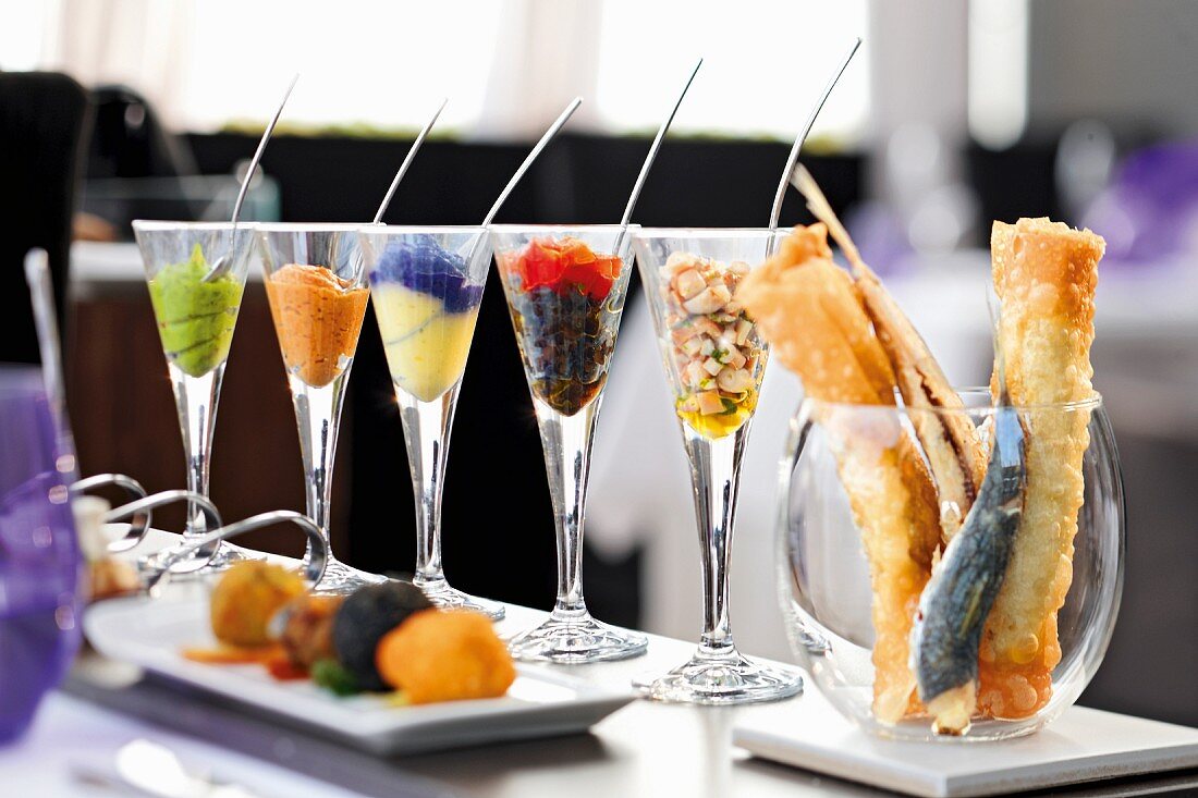 Various appetisers in glasses