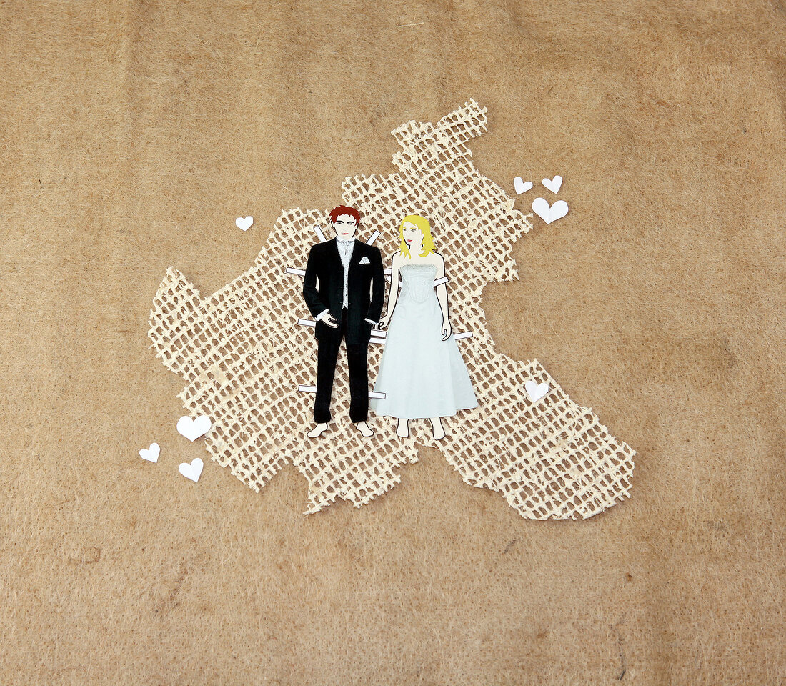 Wedding couple made of paper, overhead view