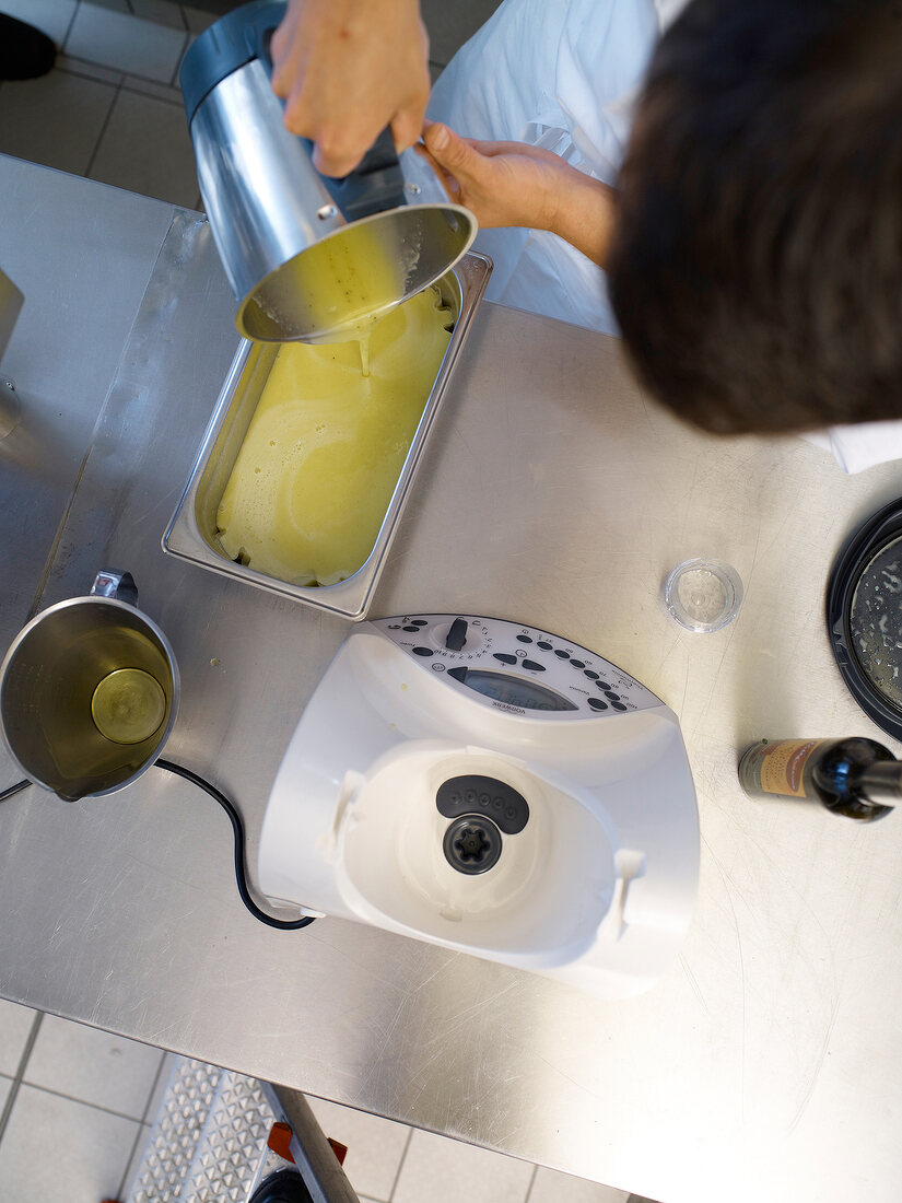 Olive oil jelly is made with the Thermomix device, overhead view