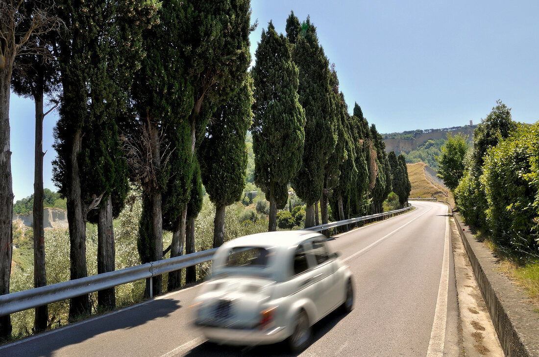 View of car on road to Volterra, Tuscany, Italy, blurred motion