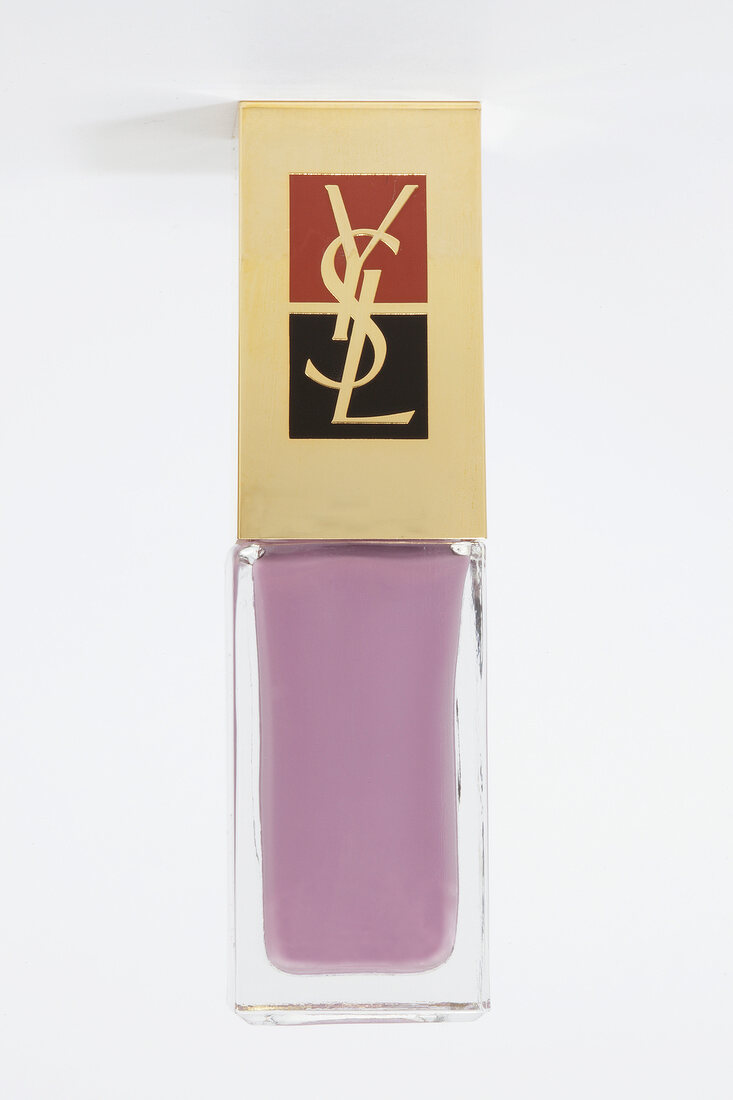 Close-up of purple nail polish in bottle