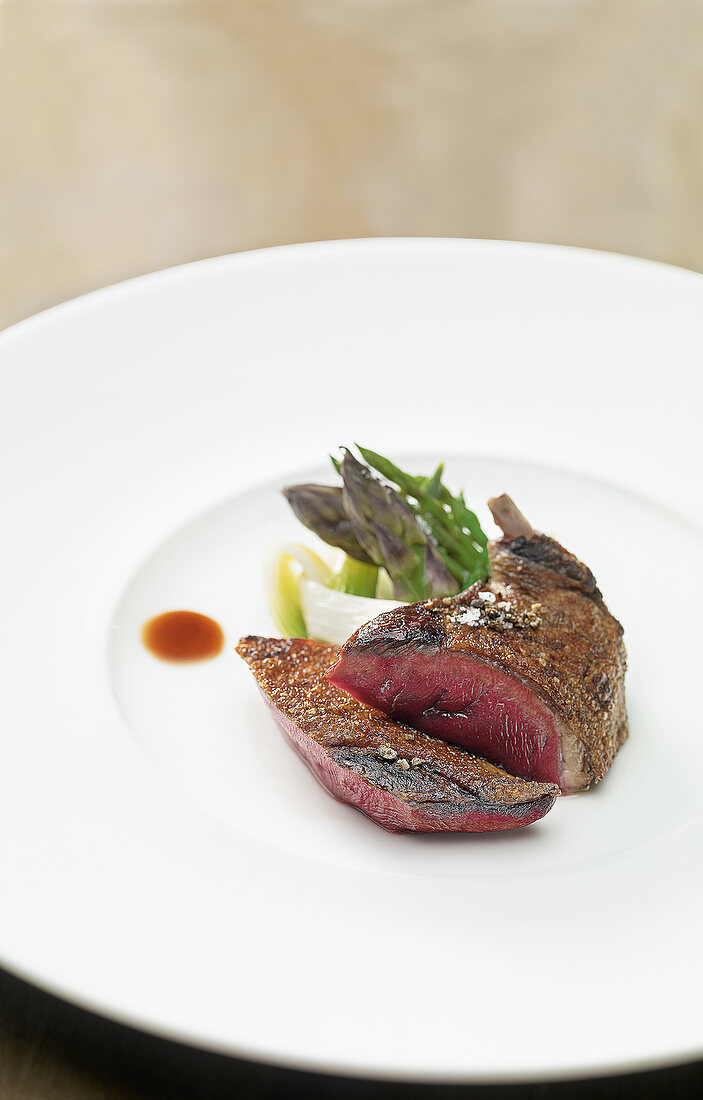 Steamed dove in red wine on plate