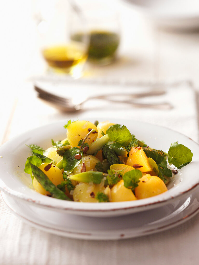 Salad with green asparagus and chervil in serving dish