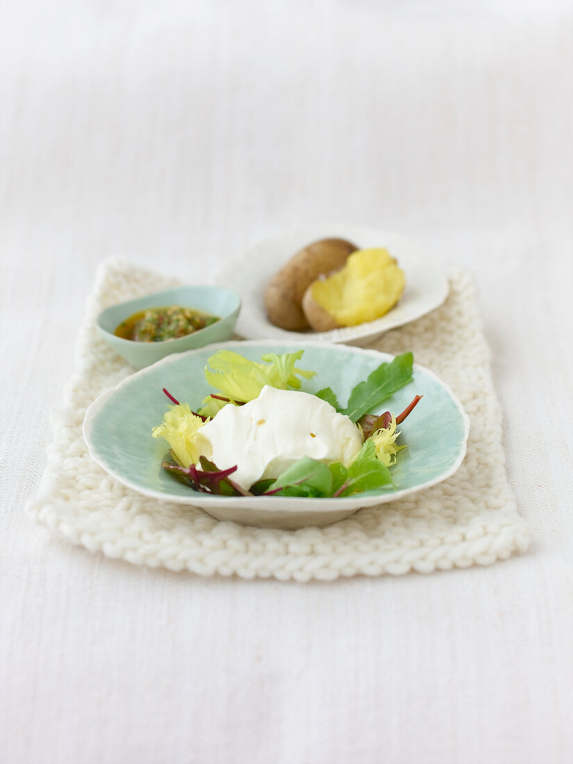 Petits Suisse cheese with walnut pesto in serving bowl