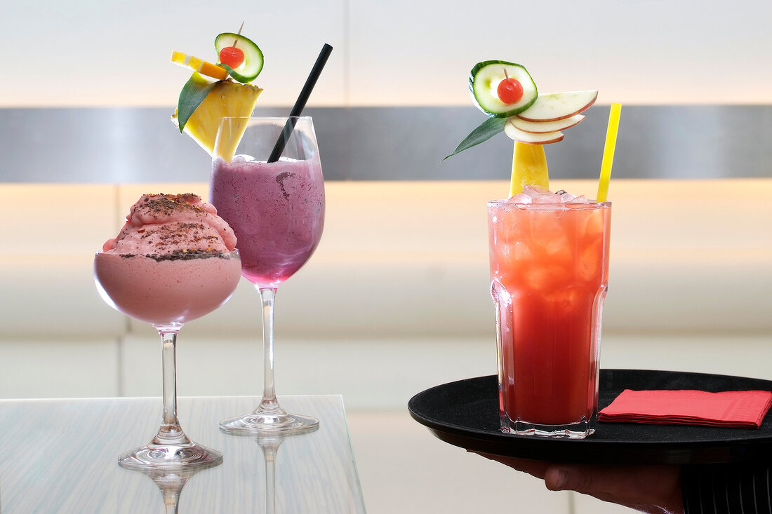Three different types of alcoholic cocktail in glasses