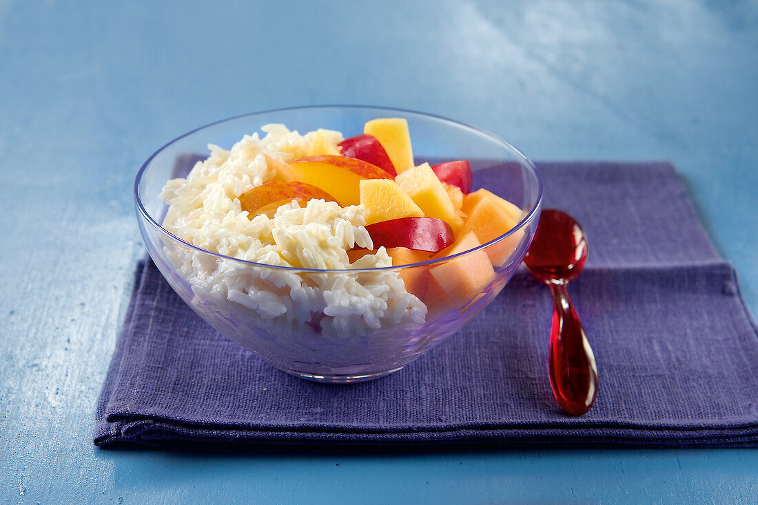 Sweet salad with fruit and rice in bowl