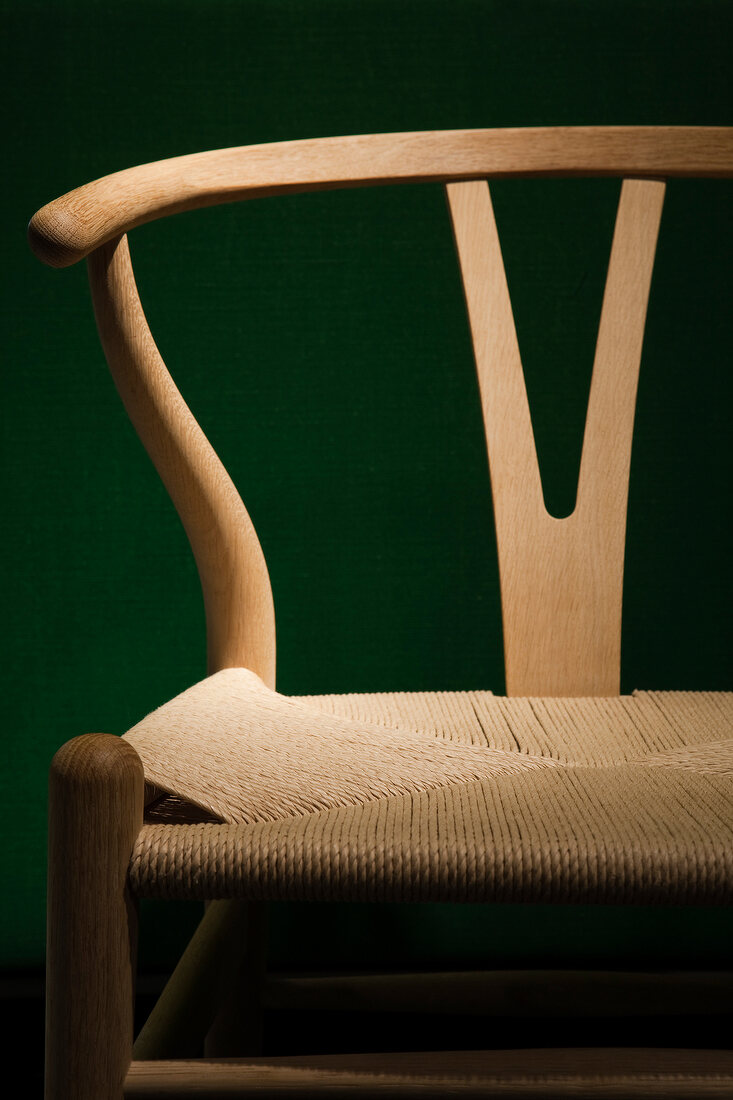 Close-up of wooden chair with seat made of paper cord