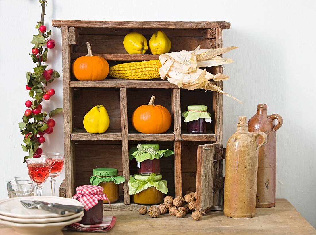 A sideboard decorated for Thanksgiving