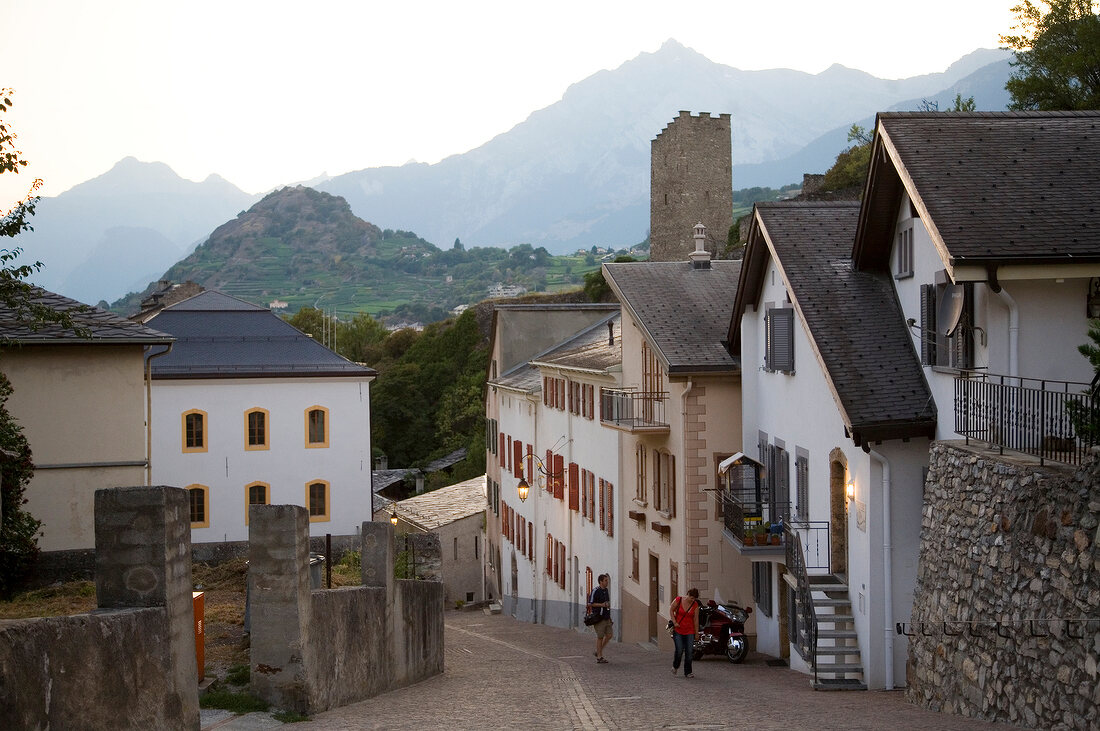 Passers by walking near street castles at Sion, Valias, Switzerland