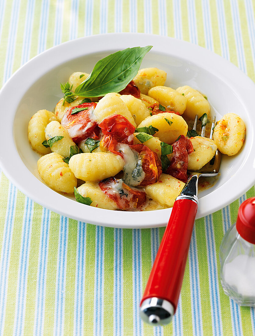 Gnocchi gorgonzola tomato and basil in License Images