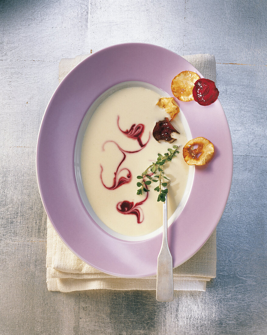 Celery root and beetroot soup in bowl