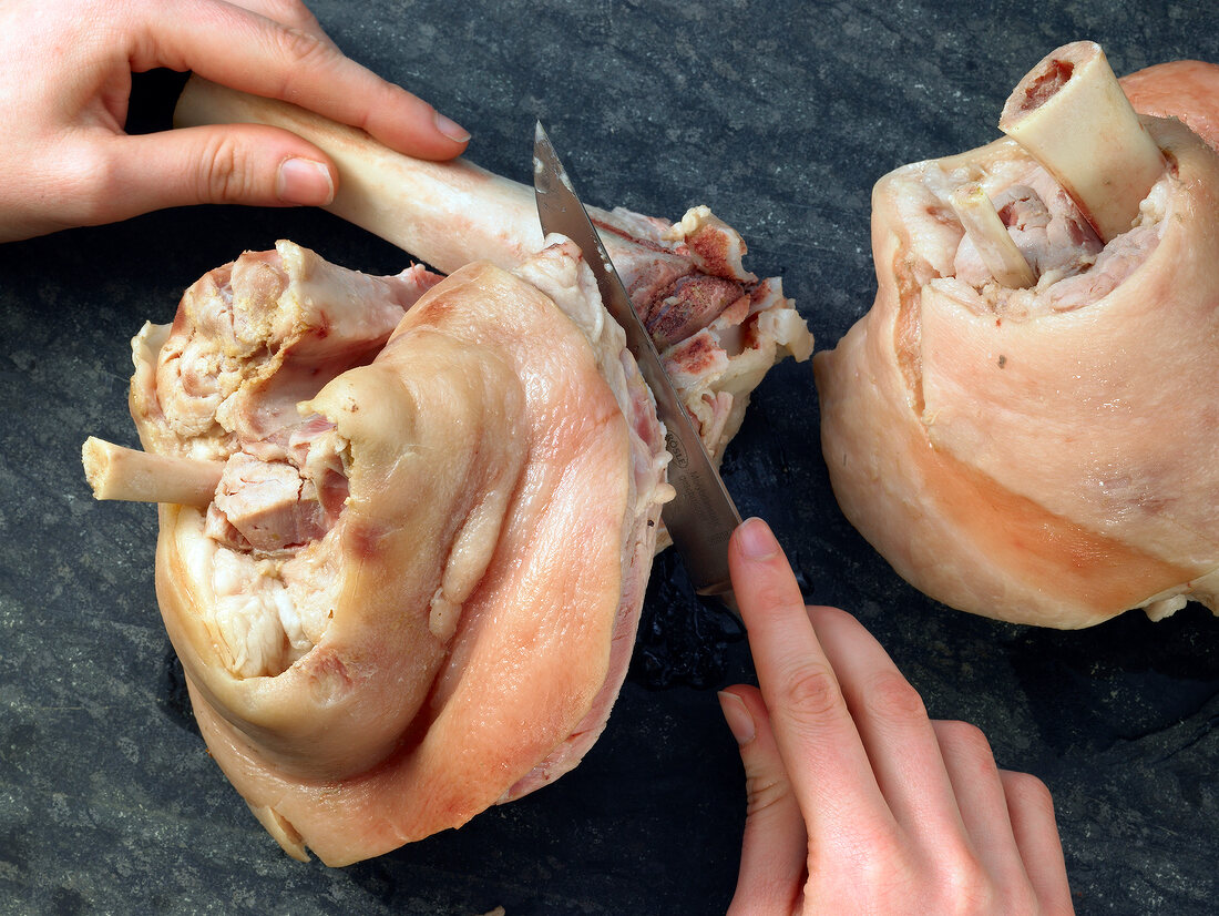 Removing bones from raw pork knuckle, step 1