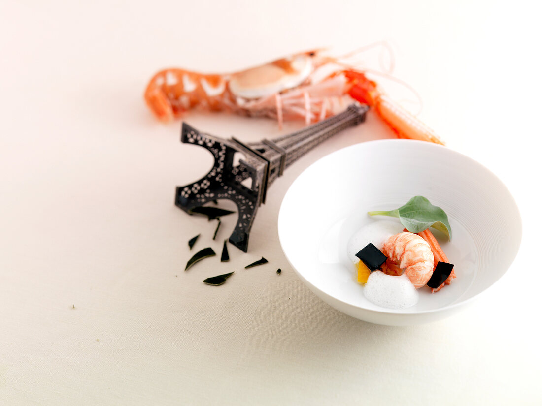 Langoustine with oyster milk and algae confit in bowl