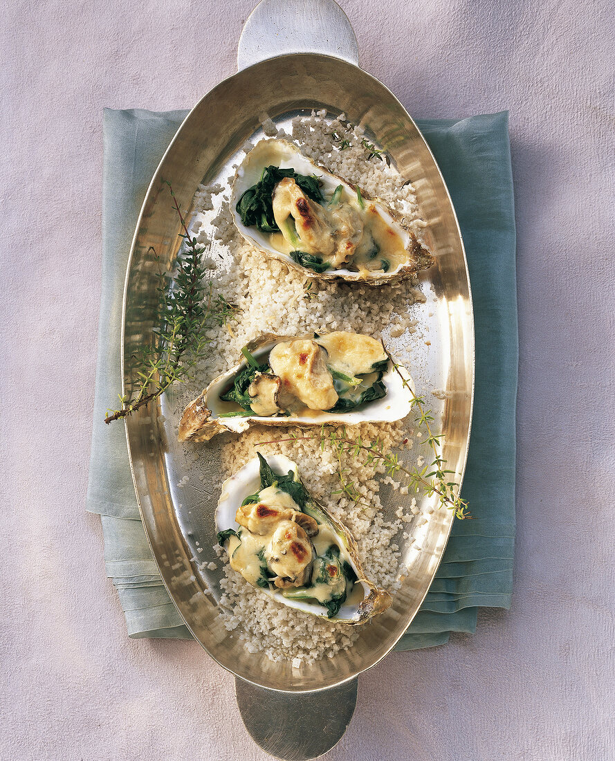 Gratin oysters in serving dish