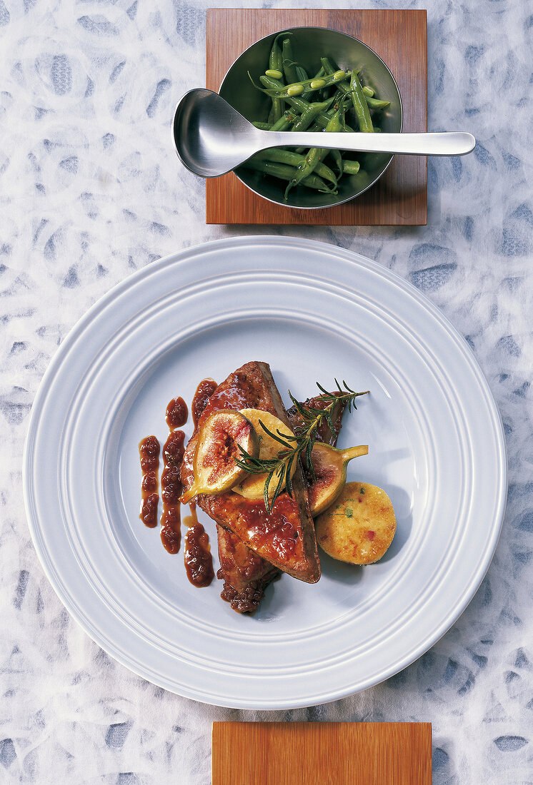 Veal liver with shallots sauce on plate