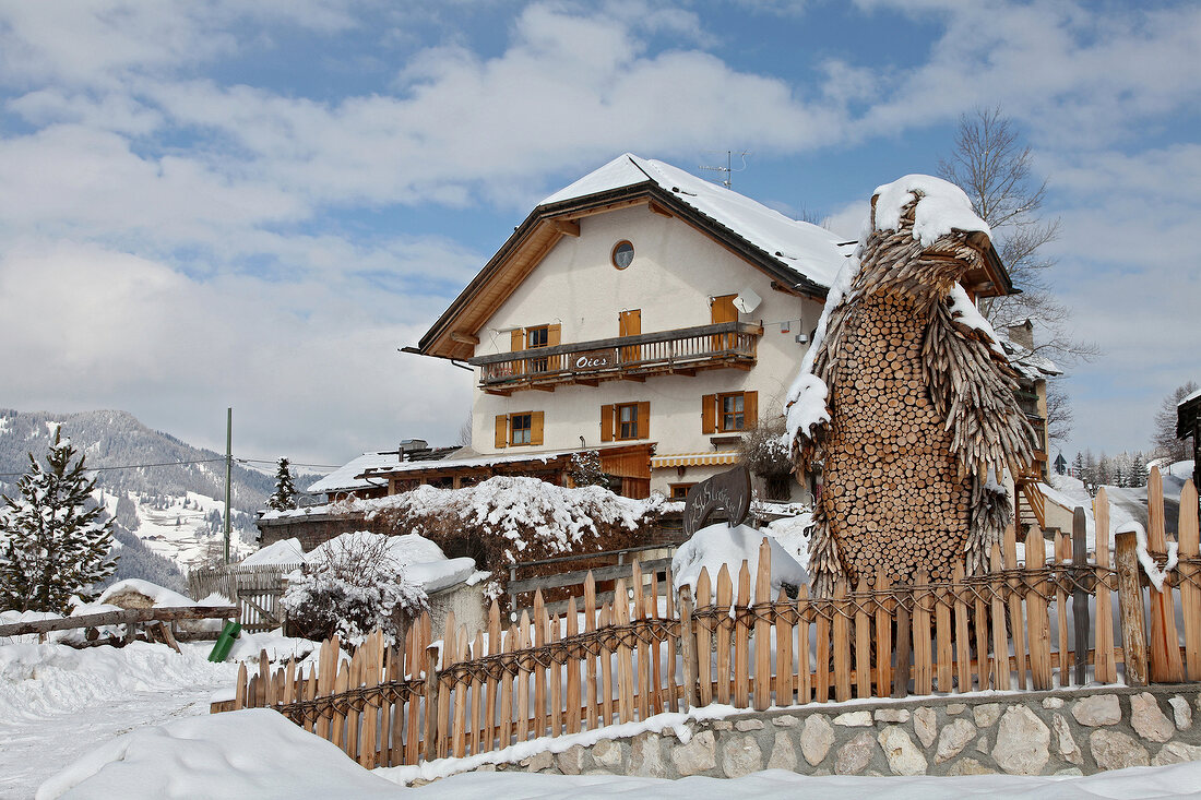 View of Restaurant Bear Cave surrounded with snow in winter, South Tyrol, Italy