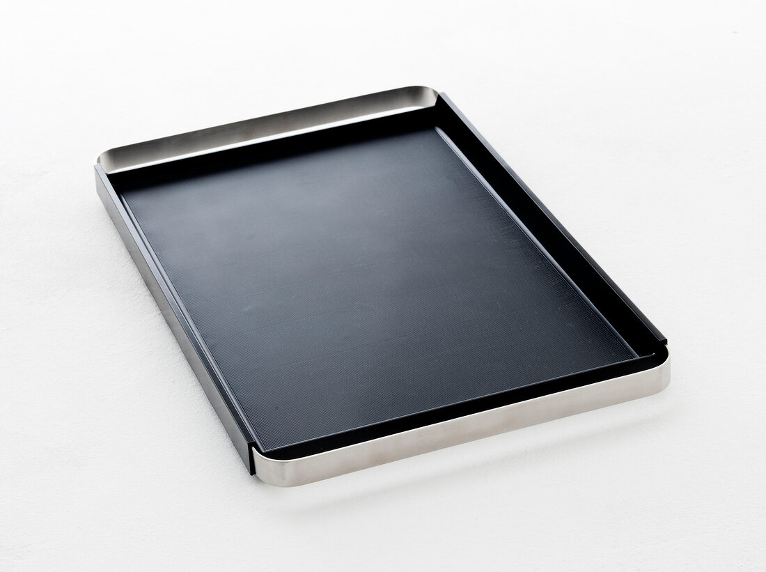 Rectangular shaped baking tray with silicone coating on white background