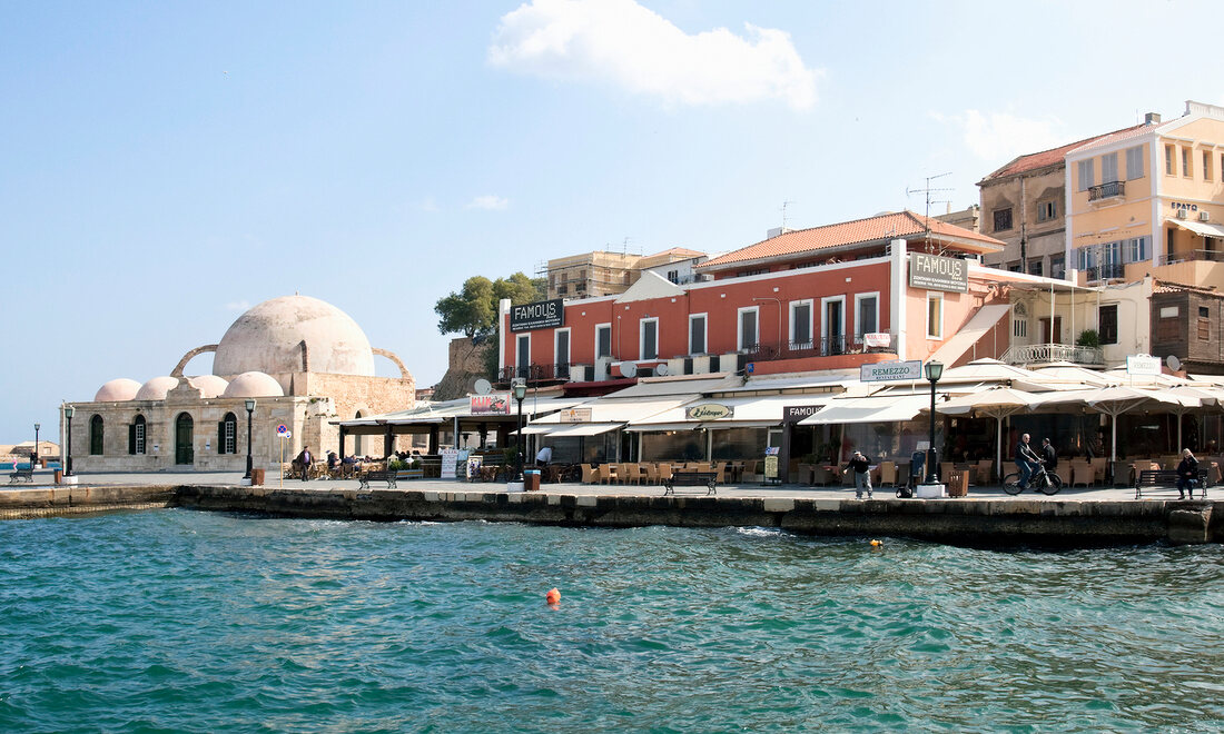 View of port city Chania and Janissaries Mosque in Crete, Greece