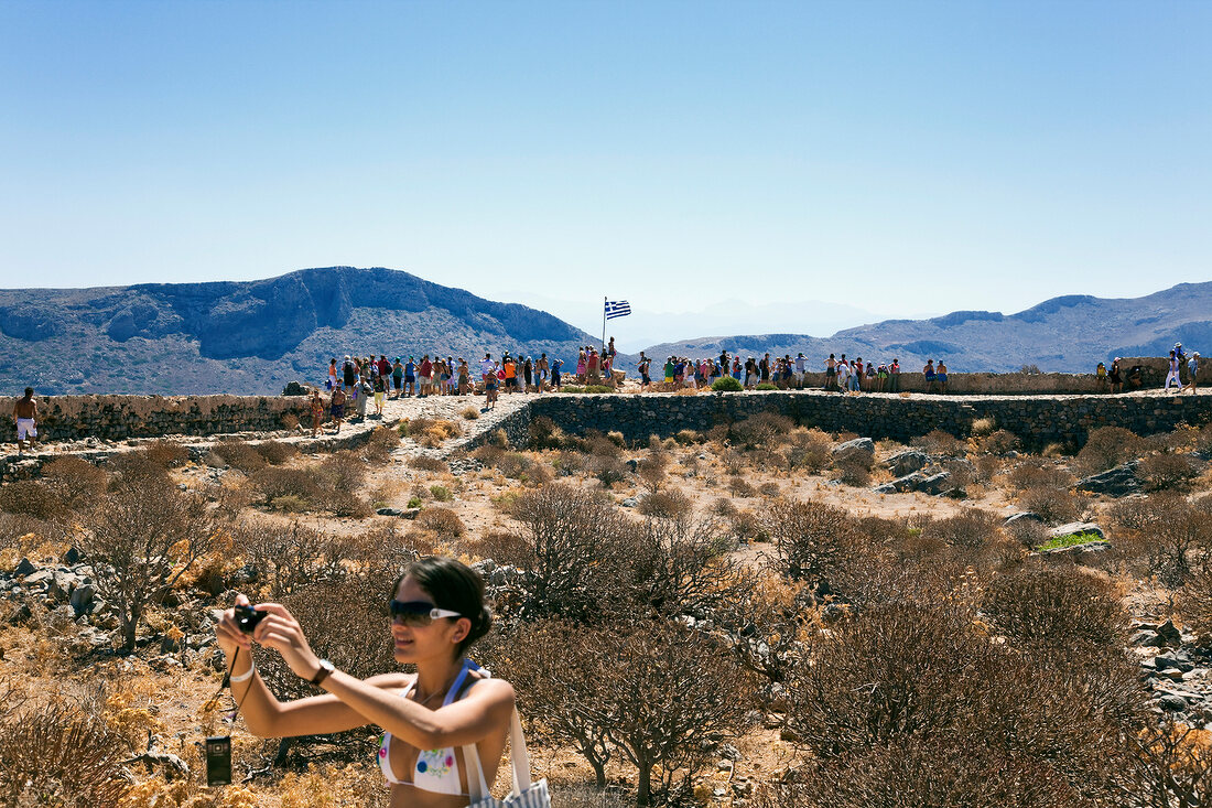 Tourists at ruined fortress Gramvoussa in Crete, Greece