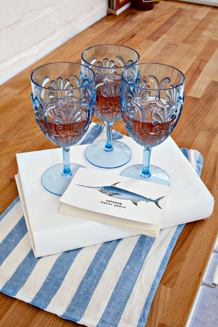 Three blue goblet wine glasses