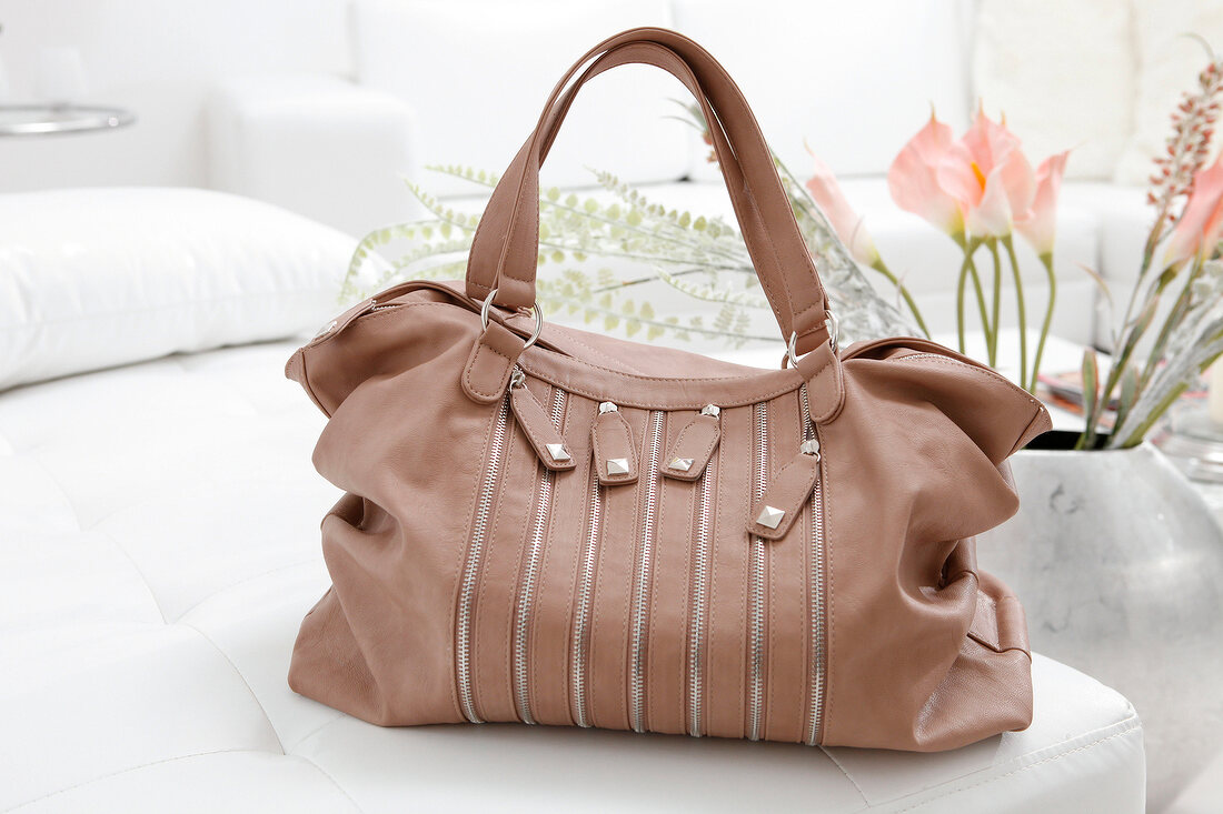 Close-up of brown leather handbag