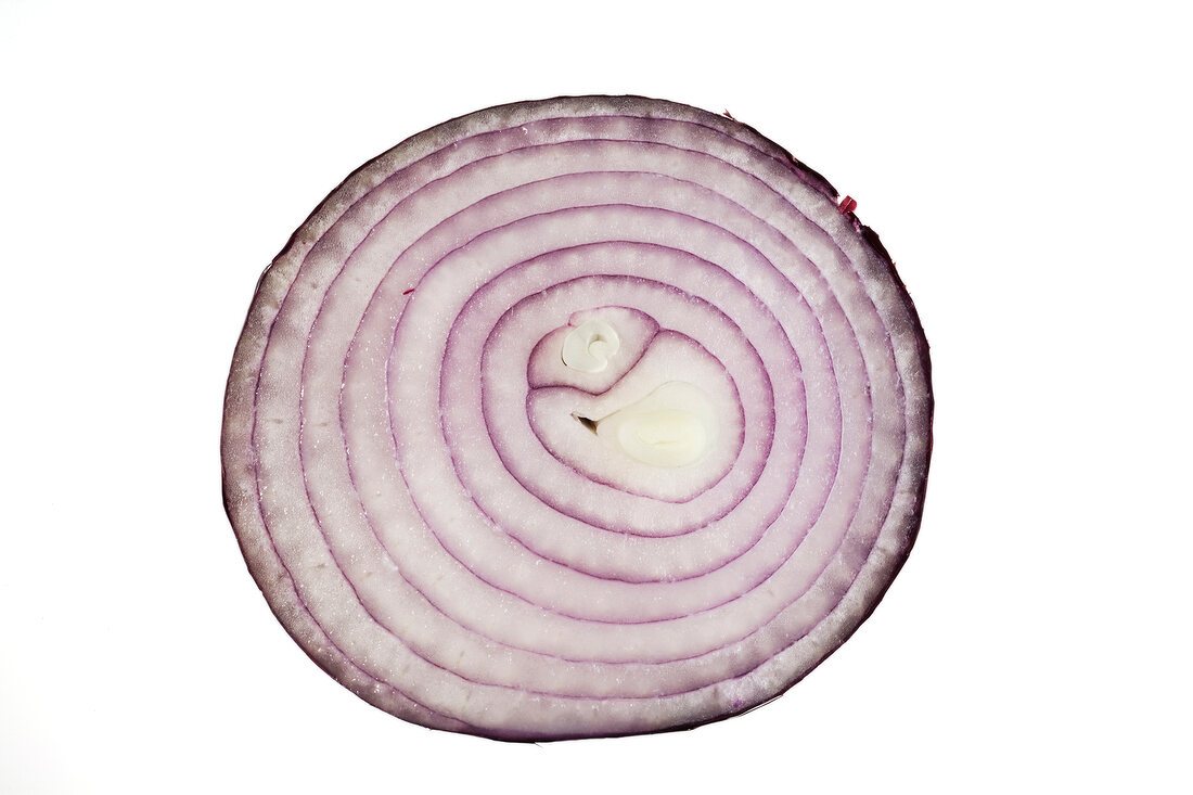 Slice of red onion on white background
