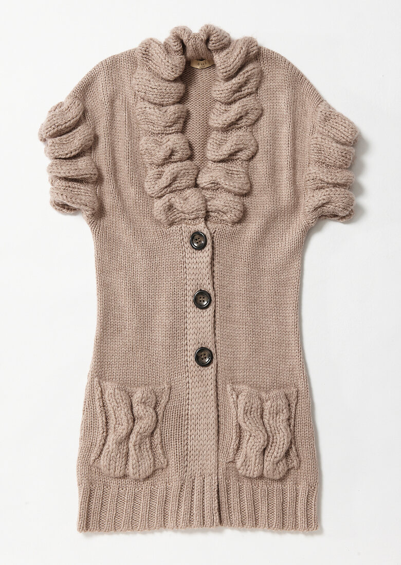 Beige colour trendy cardigan on white background