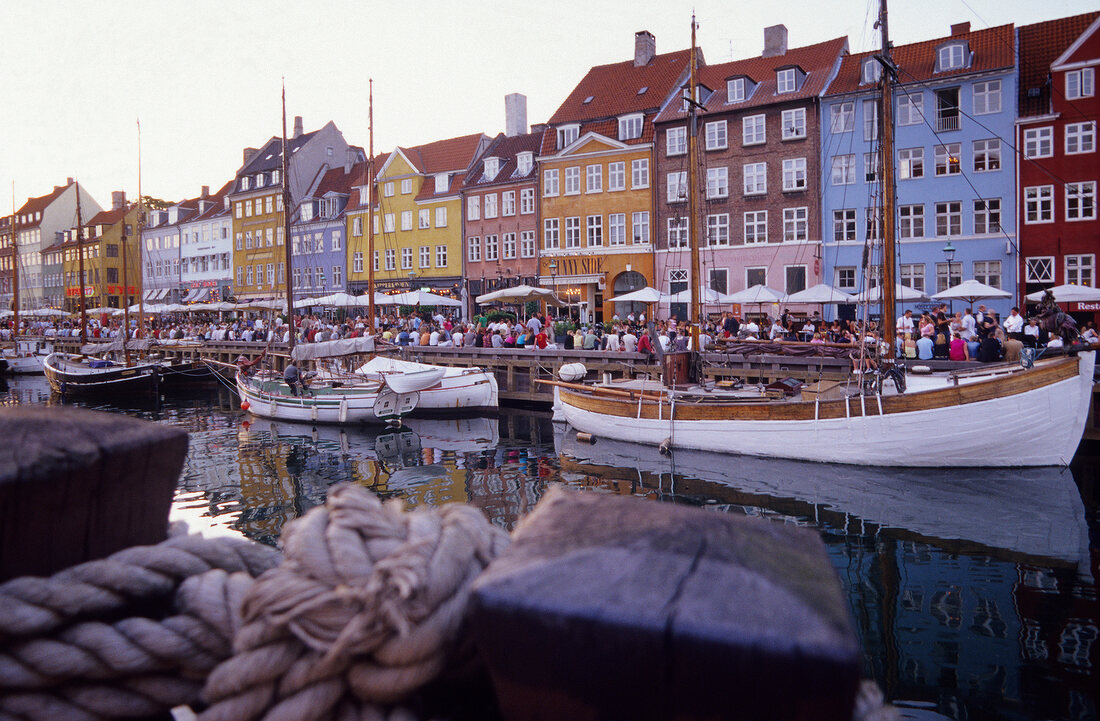 View of bars and restaurants in Nyhavn harbour in Copenhagen, Denmark