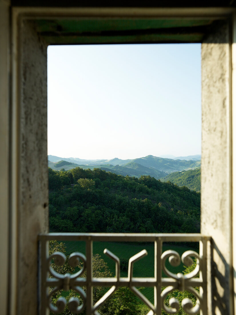 View of forest on mountains from bedroom in Tuscany, Italy