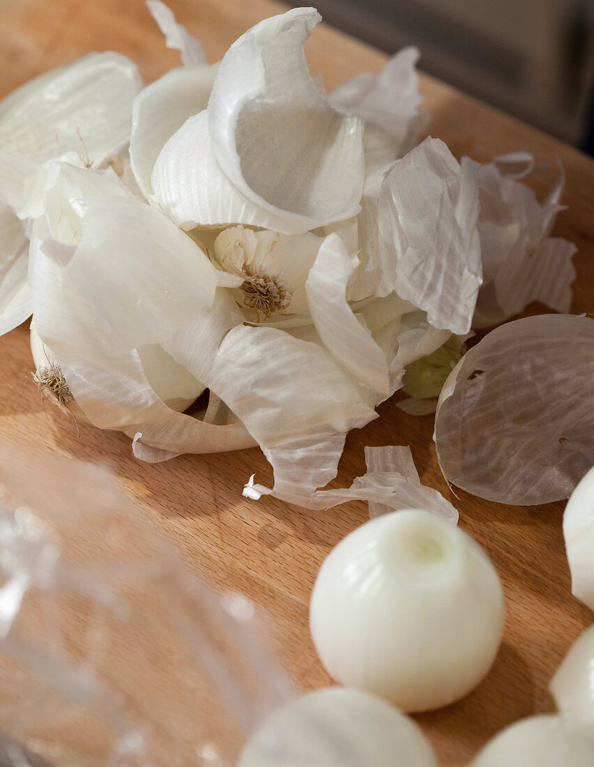 Close-up of boiled onions on wood
