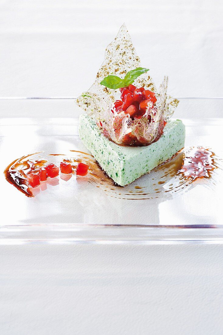 Basil mousse with balsamic strawberries on plate