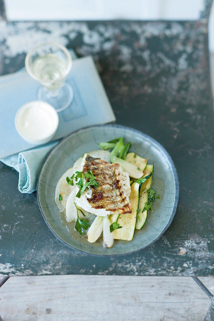 Grilled zander on a bed of vegetables